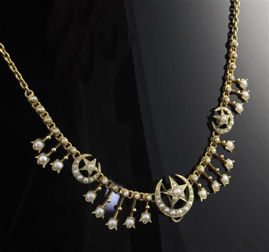 An Edwardian gold and split pearl set fringe necklace, 15in.